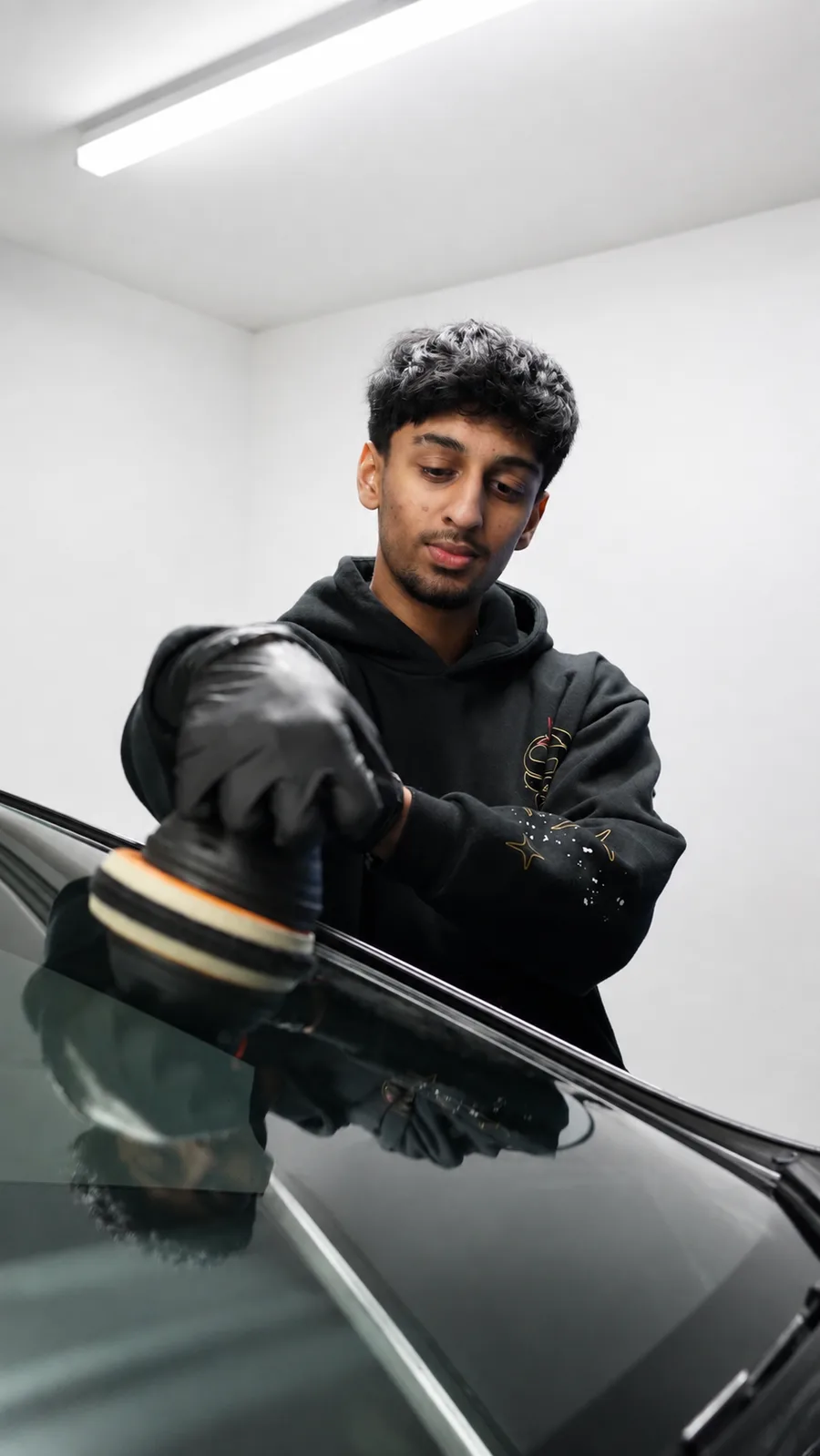 Finest Car Details technician performing paint correction in the Melbourne studio